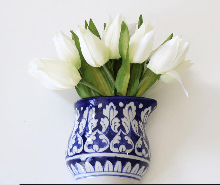 A chic blue white ceramic pottery flower vase paired with lifelike artificial flowers, bringing everlasting beauty to your home decor. Elevate your space with this timeless arrangement made by artisans gift for her in UK
