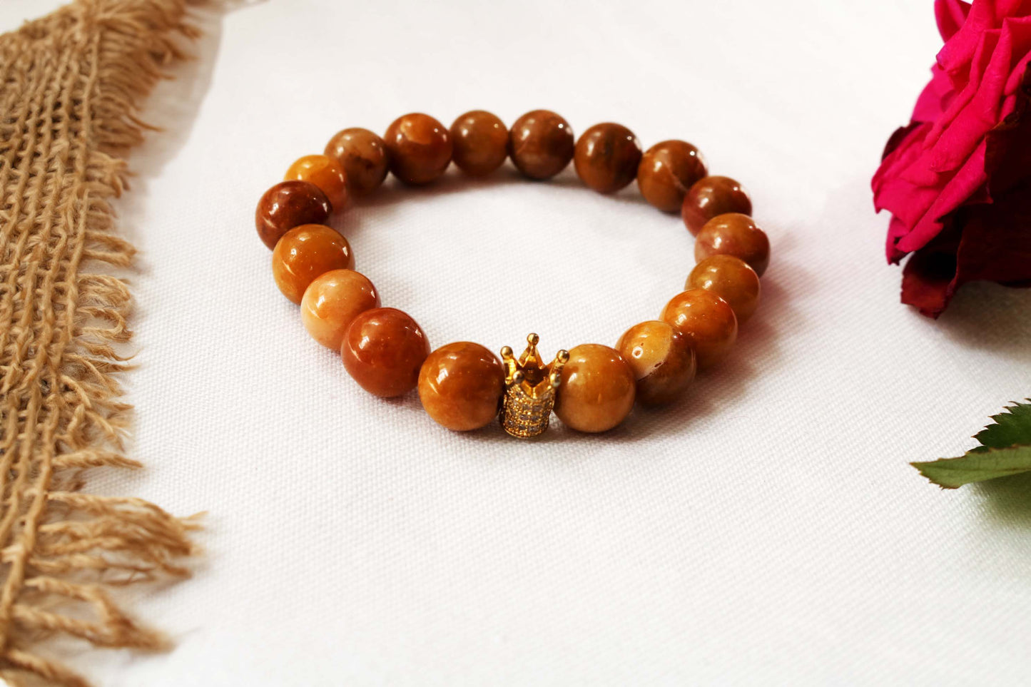 Beaded Bracelet Explore our exquisite gemstone collection, perfect for gifting on any occasion. Our Men's Mustard Gemstone Bracelet, featuring a regal crown design, is crafted with genuine mustard gemstones for a touch of sophistication. Treat him to timeless elegance. Shop now at Ethimaart.