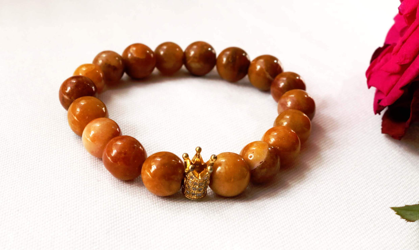 Beaded Bracelet Explore our exquisite gemstone collection, perfect for gifting on any occasion. Our Men's Mustard Gemstone Bracelet, featuring a regal crown design, is crafted with genuine mustard gemstones for a touch of sophistication. Treat him to timeless elegance. Shop now at Ethimaart.