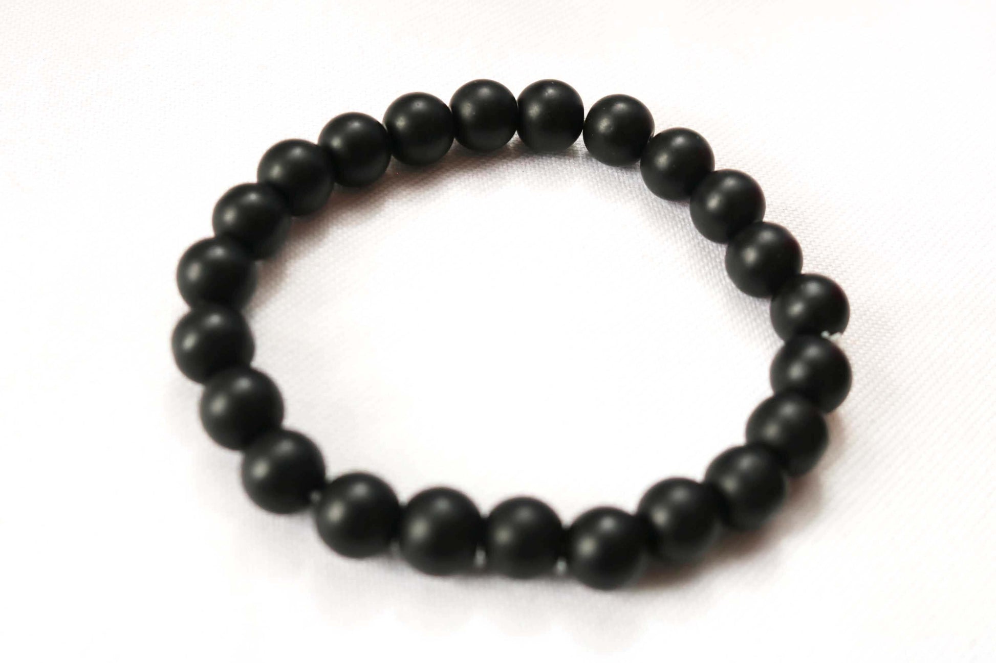 Discover sophistication with our 8mm Men Black Turquoise Gemstone Bracelet, a perfect gift for him. Handcrafted with care, this versatile piece blends rugged charm with timeless elegance. Ideal for special occasions or daily wear, it's a stylish addition to any ensemble. Shop now at Ethimaart.