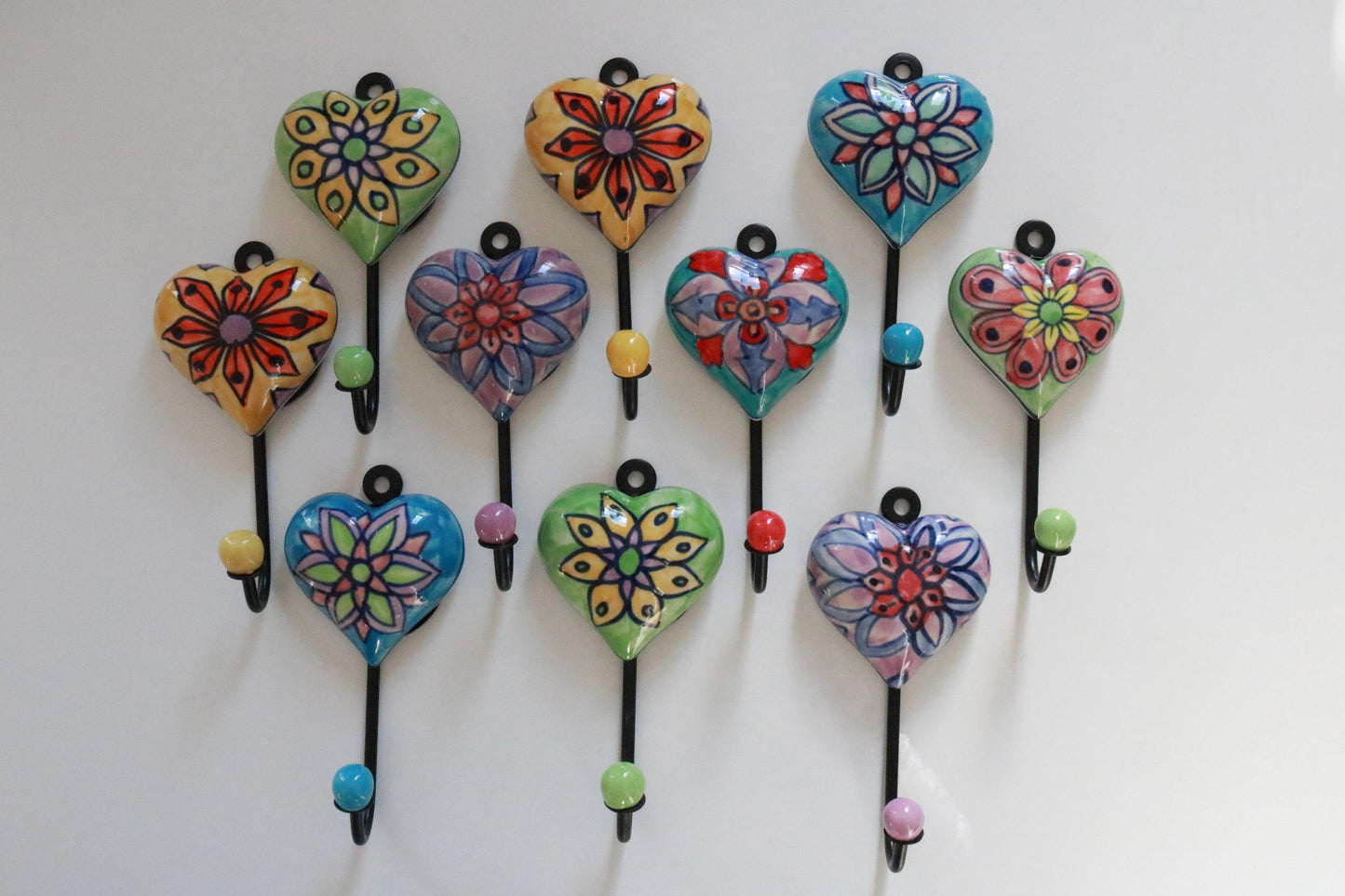 Buy our best selling handmade heart ceramic wall hooks. Perfect for hanging coats, jackets, clothes, bags, or keys and towels. Ideal for any room, easy installation includes nails & pegs. Shop Now!