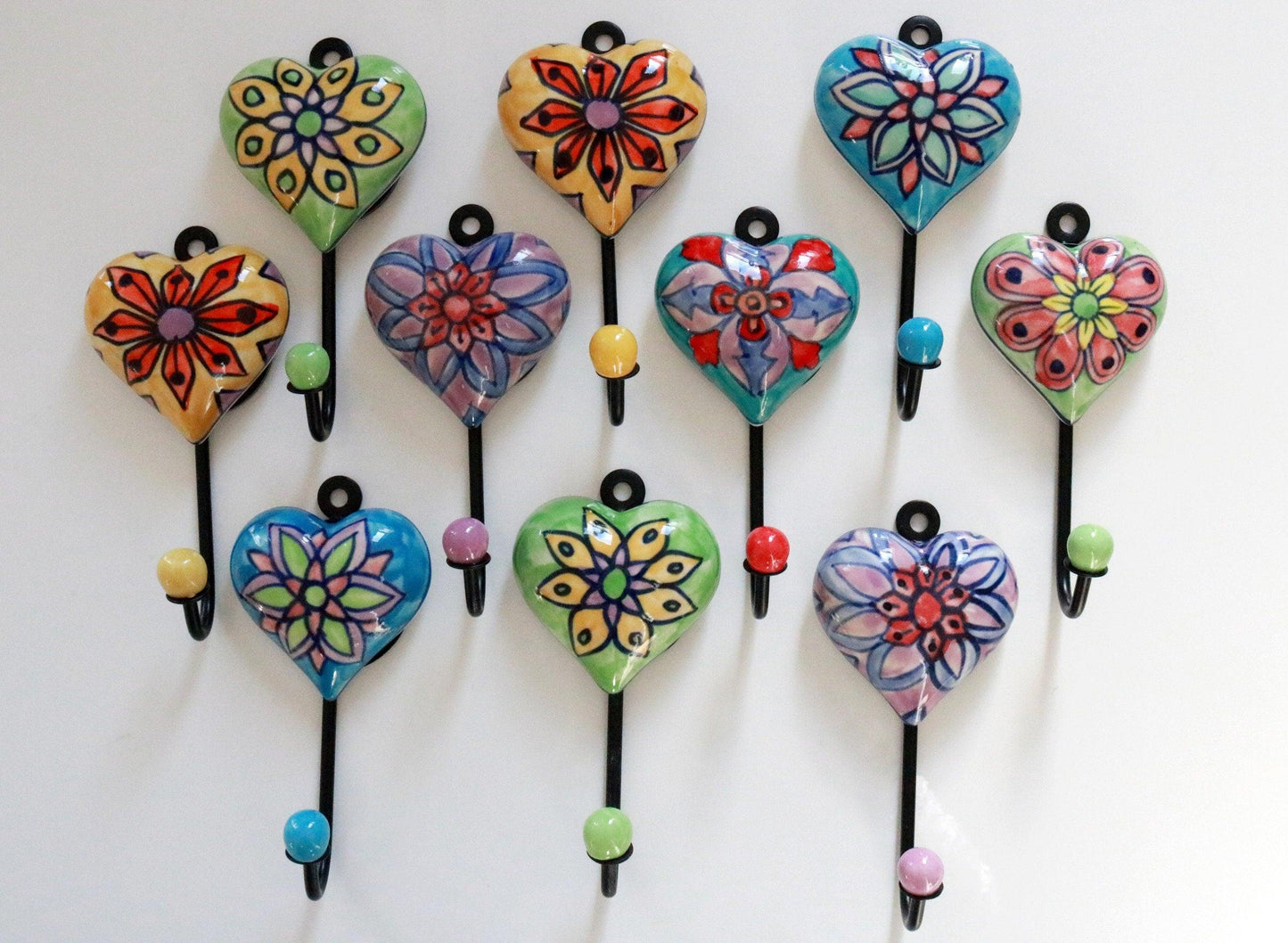 Buy our best selling handmade heart ceramic wall hooks. Perfect for hanging coats, jackets, clothes, bags, or keys and towels. Ideal for any room, easy installation includes nails & pegs. Shop Now!