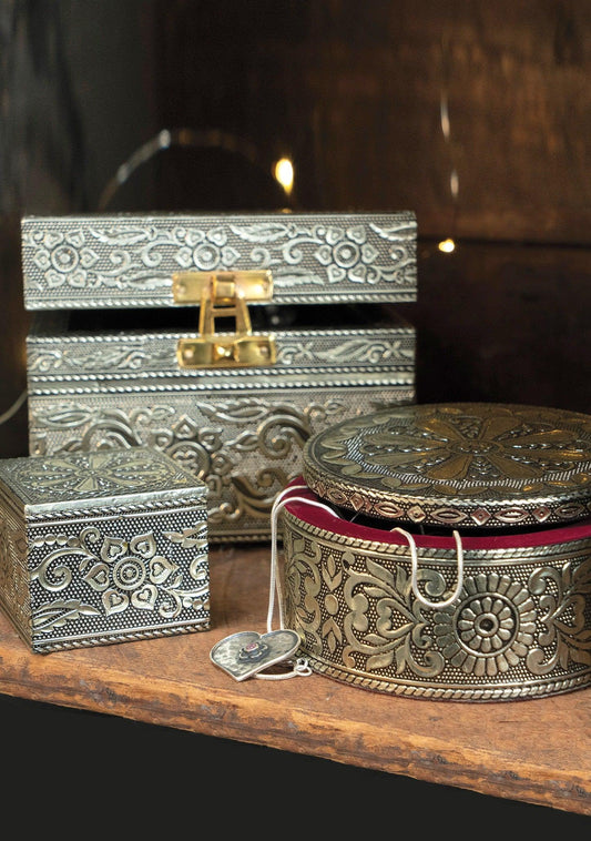 set of square, rectangle and round silver metallic embossed jewelry boxes with velvet lining