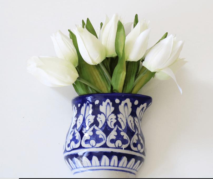 A chic blue white ceramic pottery flower vase paired with lifelike artificial flowers, bringing everlasting beauty to your home decor. Elevate your space with this timeless arrangement made by artisans gift for her in UK 
