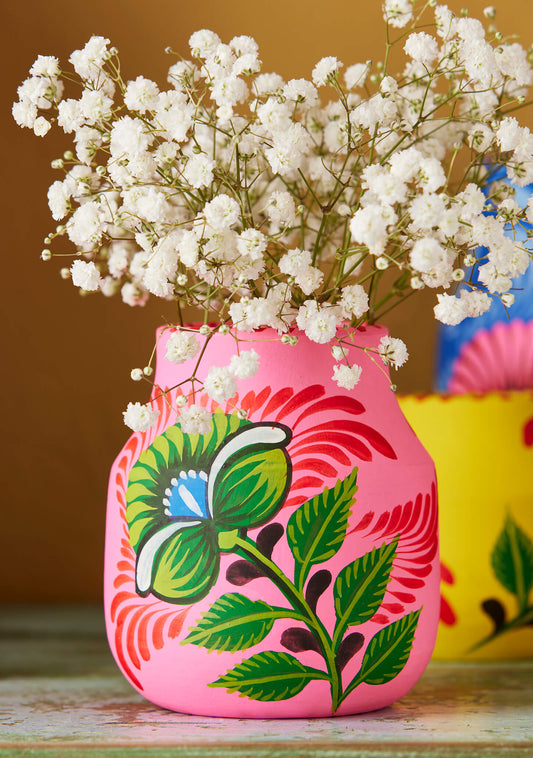 Hand painted pink and red waterlily floral design on a terracotta flower vase