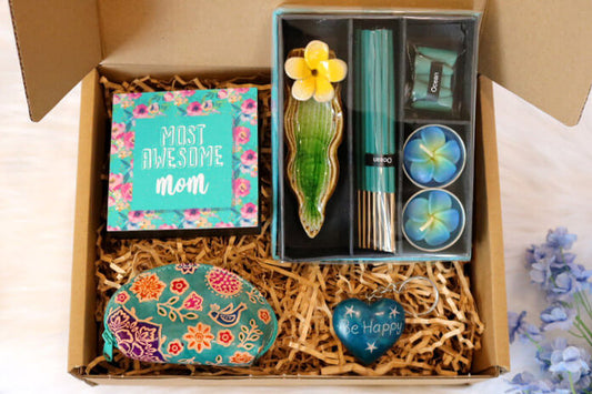 most awesome mom gift set which is also an ethical gift hamper. this contains an ocean fragrance incense gift set with tealight cangles, table top plaque, leather floral coin purse and a heart key ring