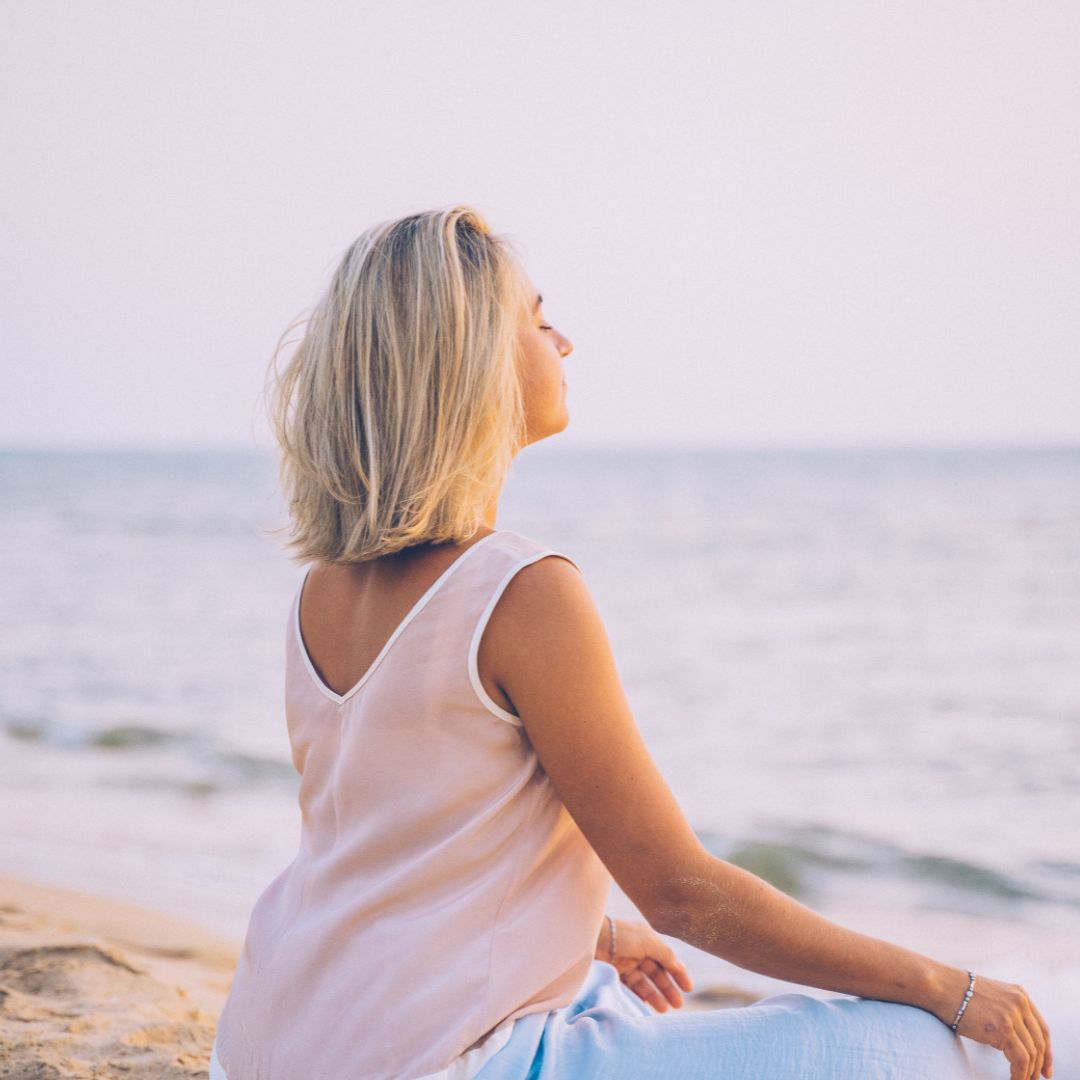 spirtual meditation near ocean in nature using incense 