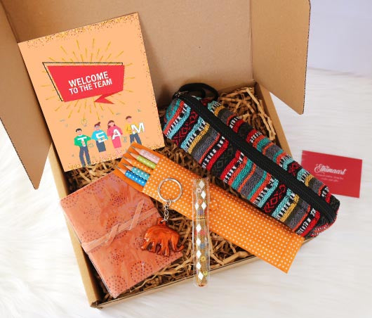 Employee Welcome Pack | Ethical Corporate Gift includes sustainable and eco friendly handmade gifts made by skilled artisans in india. It includes recycled fabric pencil case, a greeting card, set of eco friendly pencils, handmade pen, leather notebook and keychain